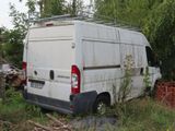 a white van that is parked in the grass