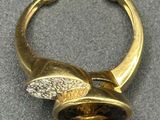 an image of a gold ring with a stone in the middle