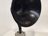 a black gramphone sitting on a table with a white background