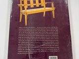 the back cover of a book with a picture of a wooden bench