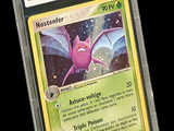 a close up of a pokemon card with a purple dragon on it
