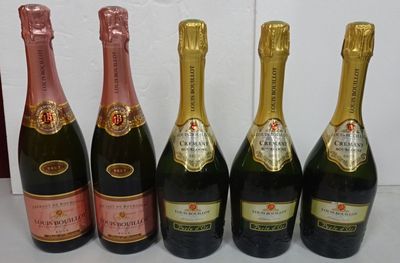 six bottles of champagne are lined up in a row on a table