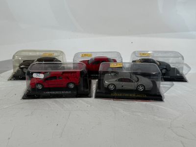 four different models of cars in a display case on a white surface