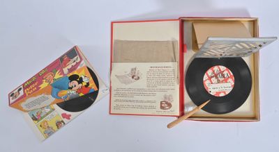 un disque dans une boîte contenant un bâton en bois