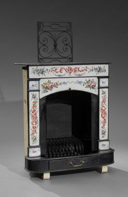 a small black and white fire place with a clock on top
