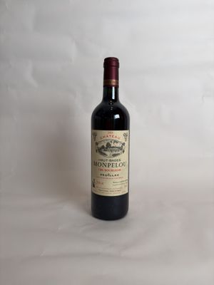 a bottle of wine that is sitting on a table