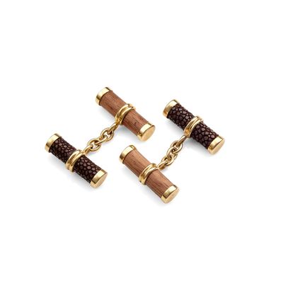 three pairs of wooden and leather cufflinks on a white background