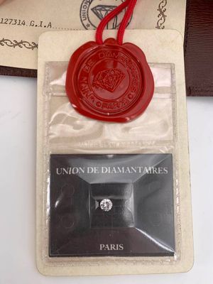 a wax seal with a red wax stamp on it