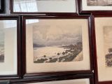 many pictures hanging on the wall of a room