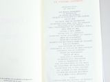 an open book on a table with a bunch of writing on it