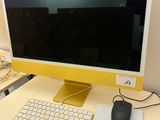 a computer on a desk with a keyboard and mouse