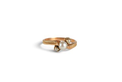 an image of a gold ring with two pearls on it