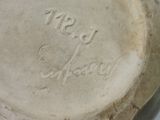 a close up of a plate with writing on it