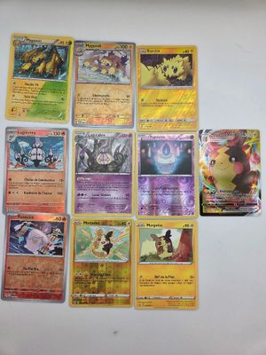 beaucoup de cartes pokemon sur la table