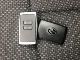 a remote control and a cell phone on a couch