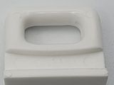 a close up of a toilet seat handle on a white surface