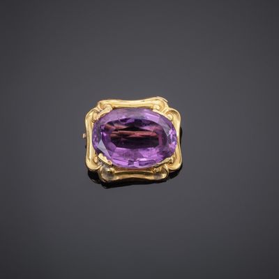 an amethorate and gold broochle, by van cleef