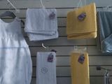 many towels hanging on a rack in a store