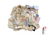 a pile of old letters and papers on a white surface
