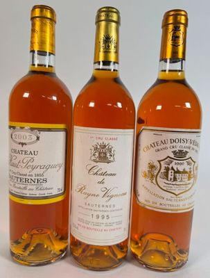three bottles of wine sitting next to each other on a table