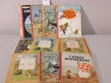several children ' s books are lined up on a table