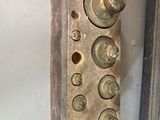 a close up of a metal door handle with screws on it
