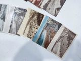 many old photos of people on the table together