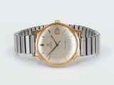 an image of a gold and silver wrist watch on a white background