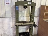 a machine that is sitting on the ground in front of a building