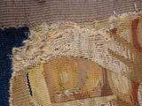 a close up of a piece of fabric with a picture of a man on a horse