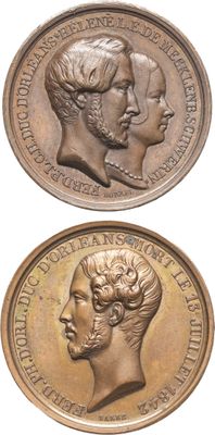 deux médaillons en bronze représentant les têtes d'un homme et d'une femme
