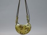necklace made from a piece of wood with a chain around it