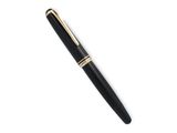 a close up of a pen on a white surface with a white background