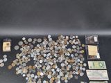some of the coins are scattered on the table and there is a picture of them