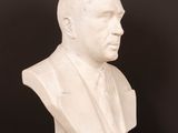 a close up of a bust of a man on a table