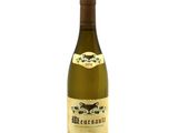 a bottle of wine that is sitting on a table