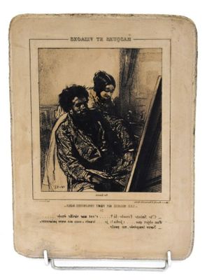 une vieille photo représentant une femme et un enfant assis sur une chaise