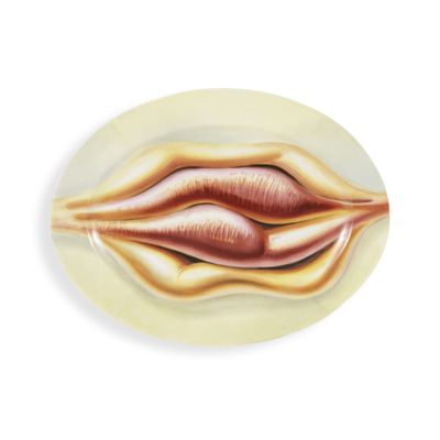 a plate with a painting of a lip on it