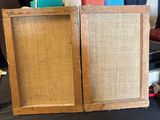 two wooden frames that are sitting on a table