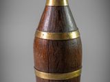an image of a wooden vase with a gold rim around the neck