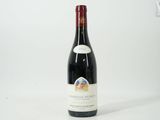 a bottle of wine that is sitting on a table
