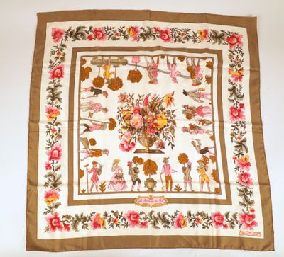 a brown and white scarf with a picture of flowers on it