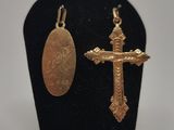 a close up of a cross and a medal on a display