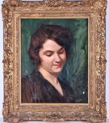 portrait of a woman in a black dress by a gold frame