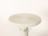 a white table with a circular design on top of it