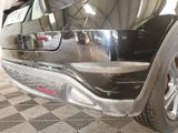 a close up of a car ' s front bumper and fender