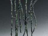 sculpture représentant un groupe d'arbres posée sur un socle, sur une surface blanche