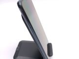 a close up of a cell phone on a stand