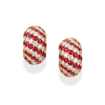 a pair of ruby and diamond earrings