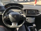 a steering wheel and dashboard of a car in a parking lot